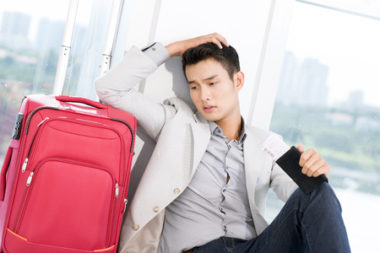 frustrated traveler with luggage