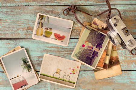 photo album of trip in summer on wood table. instant photo of retro camera - vintage and retro style