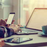 smartphone and laptop with coffee cup