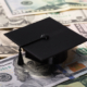 graduation cap and money