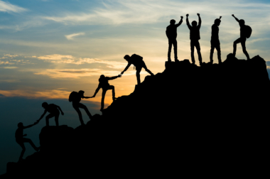 silhouettes on mountain top