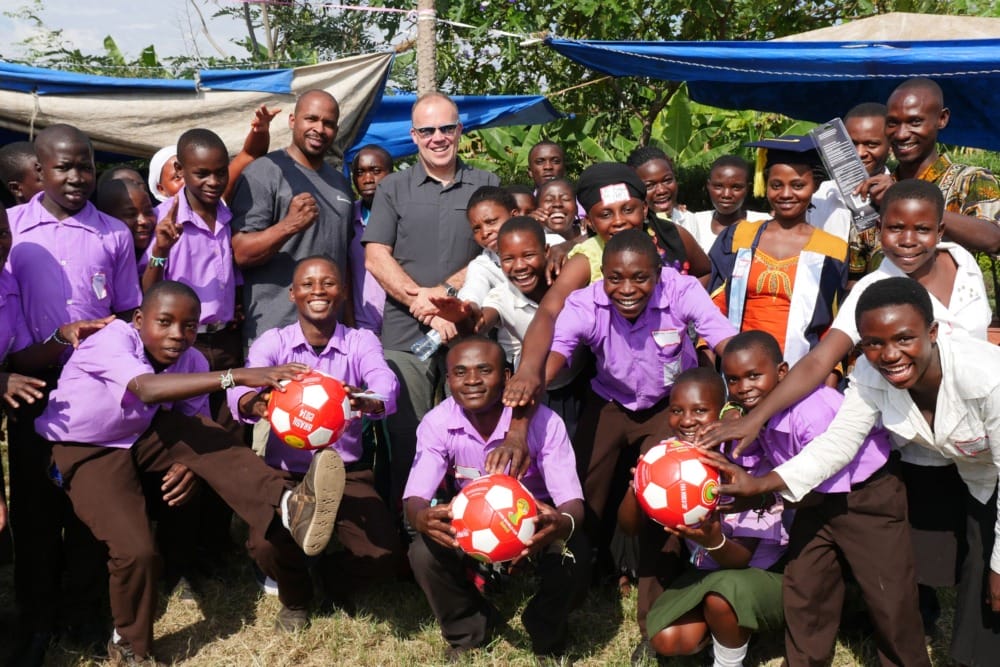 large group of smiling students and teachers