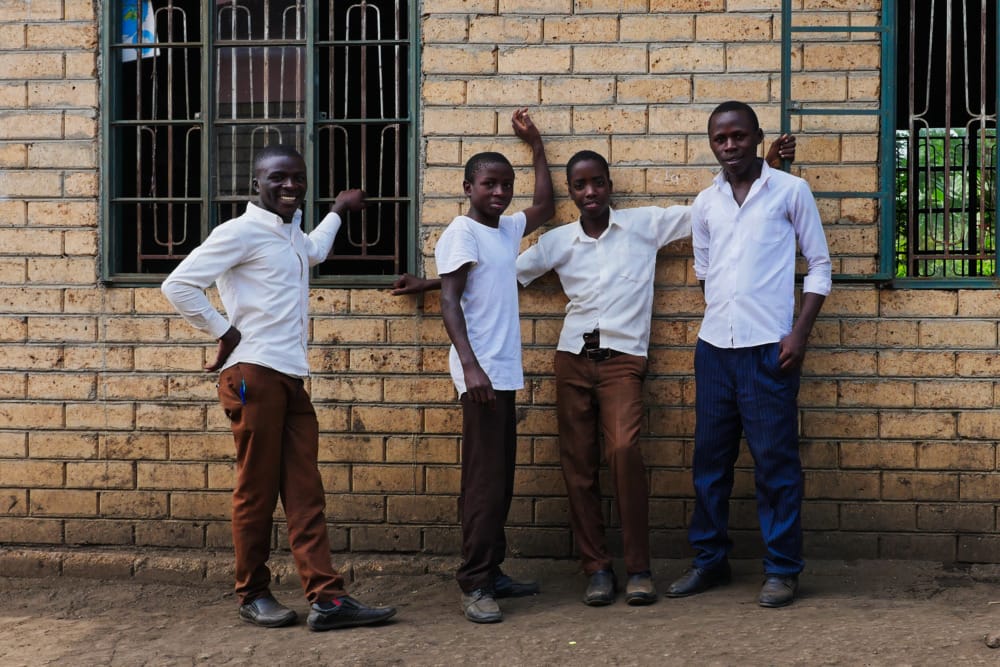 students in front of building