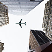 airplane flying over city