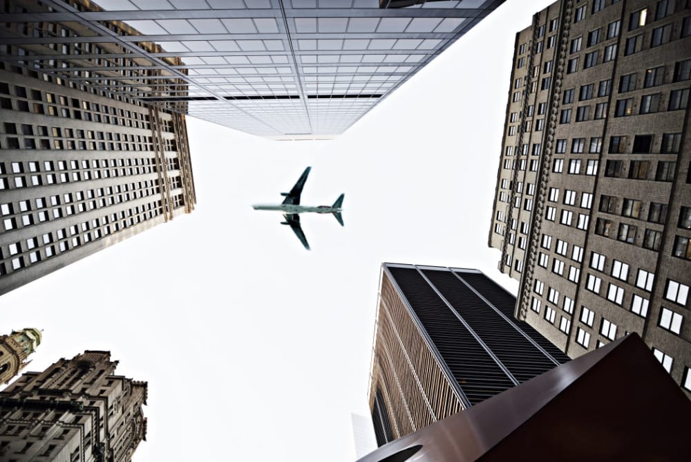 airplane flying over city