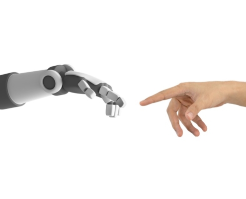 human and robot hands reaching to touch