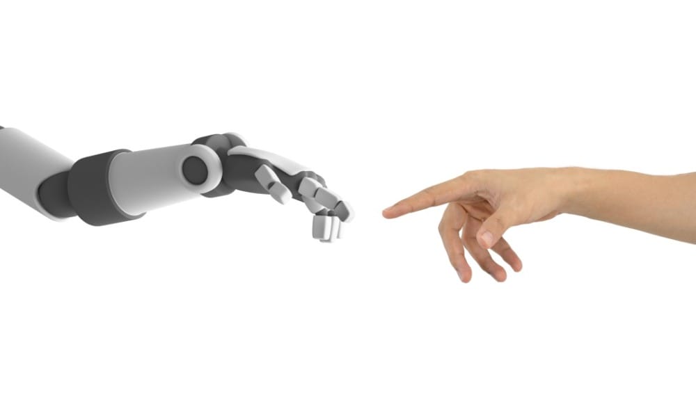 human and robot hands reaching to touch