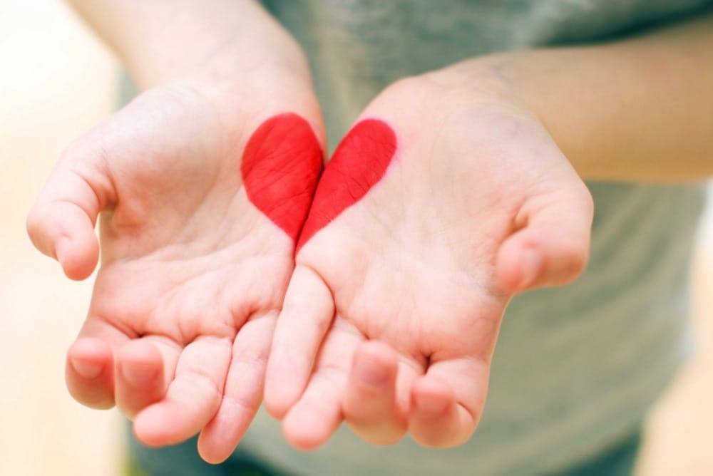 hands with heart painted on