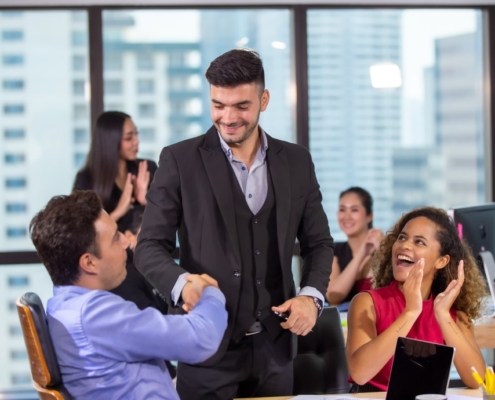 clapping for business leader