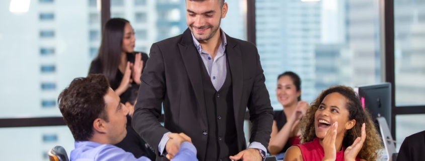 clapping for business leader