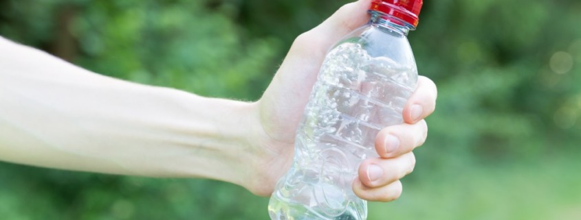 hand holding water bottle