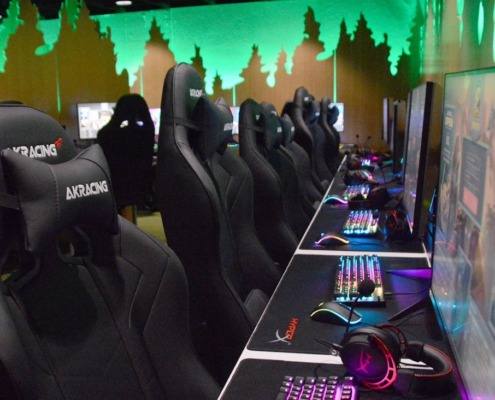 empty chairs in front of gaming computers