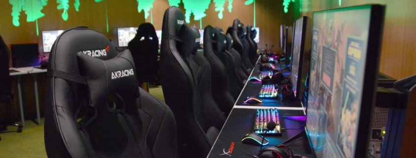empty chairs in front of gaming computers