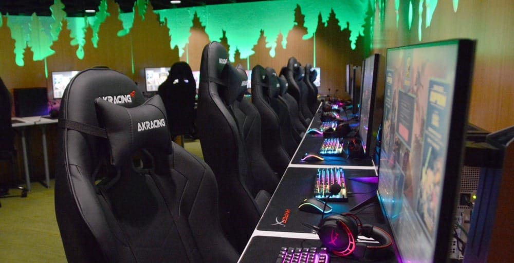 empty chairs in front of gaming computers
