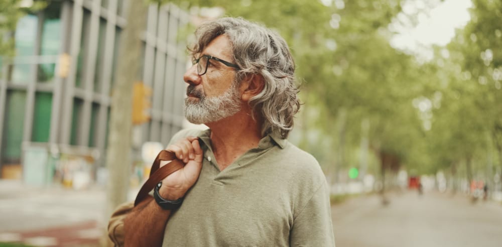 Middle-aged man with gray hair and beard