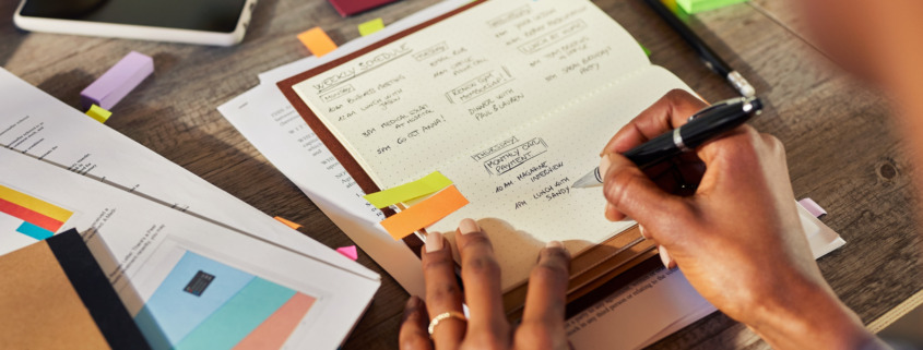 woman writing down a schedule