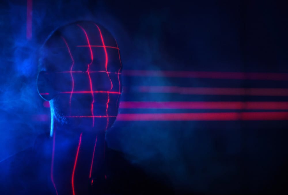 face getting scanned by red laser