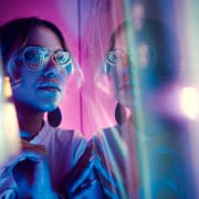 Trendy young woman looking into the distance