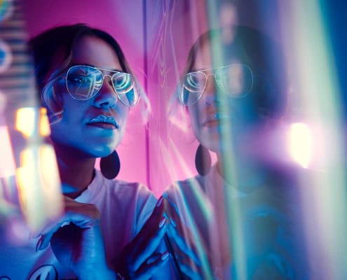 Trendy young woman looking into the distance