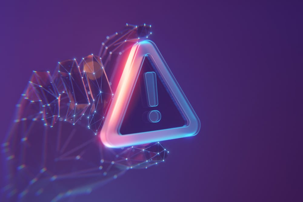 Hand made of connected points holding a triangle warning sympbol