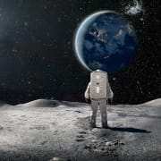 astronaut-looking-at-earth Astronaut standing on the moon and looking at earth