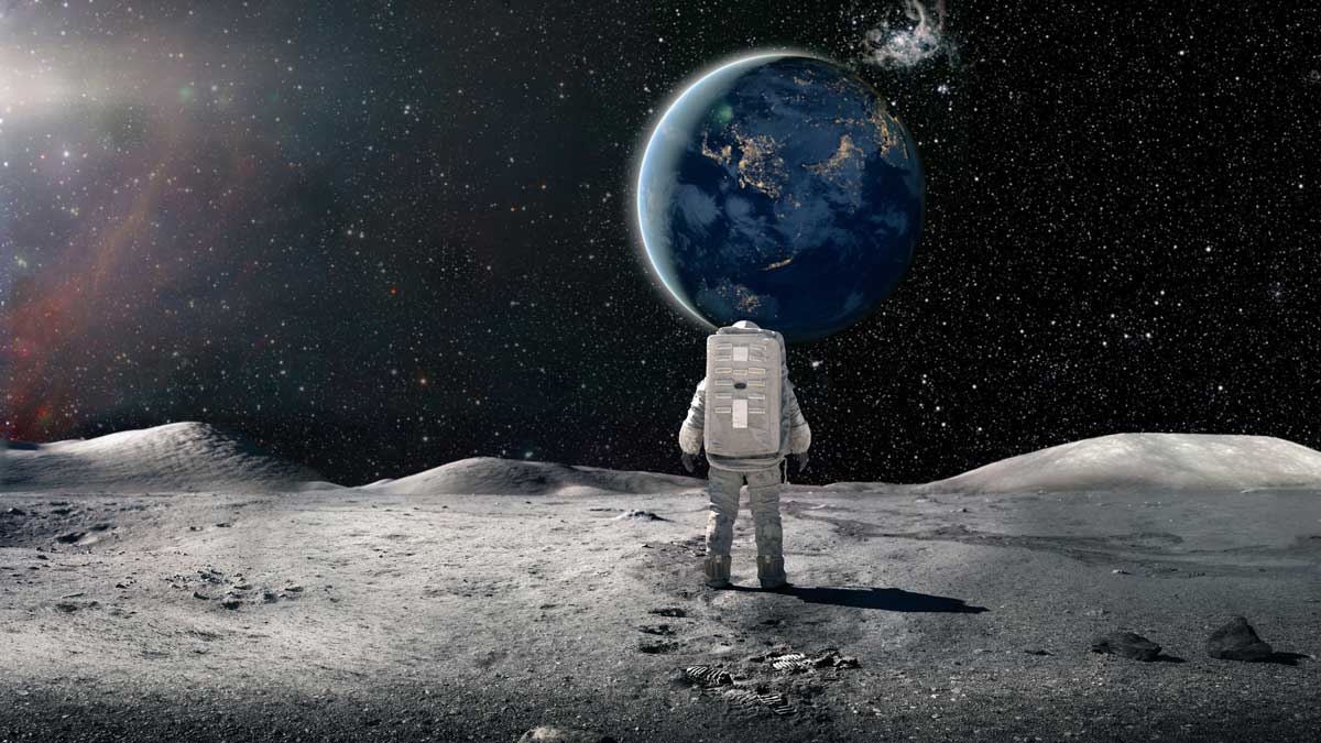 Astronaut standing on the moon and looking at earth