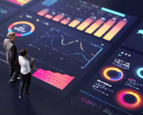 Two executives talking and standing on a giant executive data dashboard