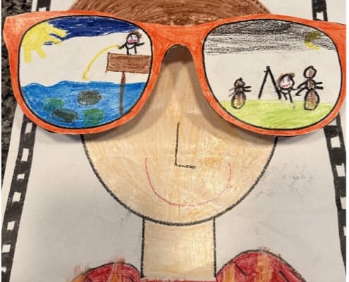 Student artwork showing a face with oversized sunglasses that reflect summer activities.
