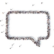 Overhead view of a chat bubble icon formed by people